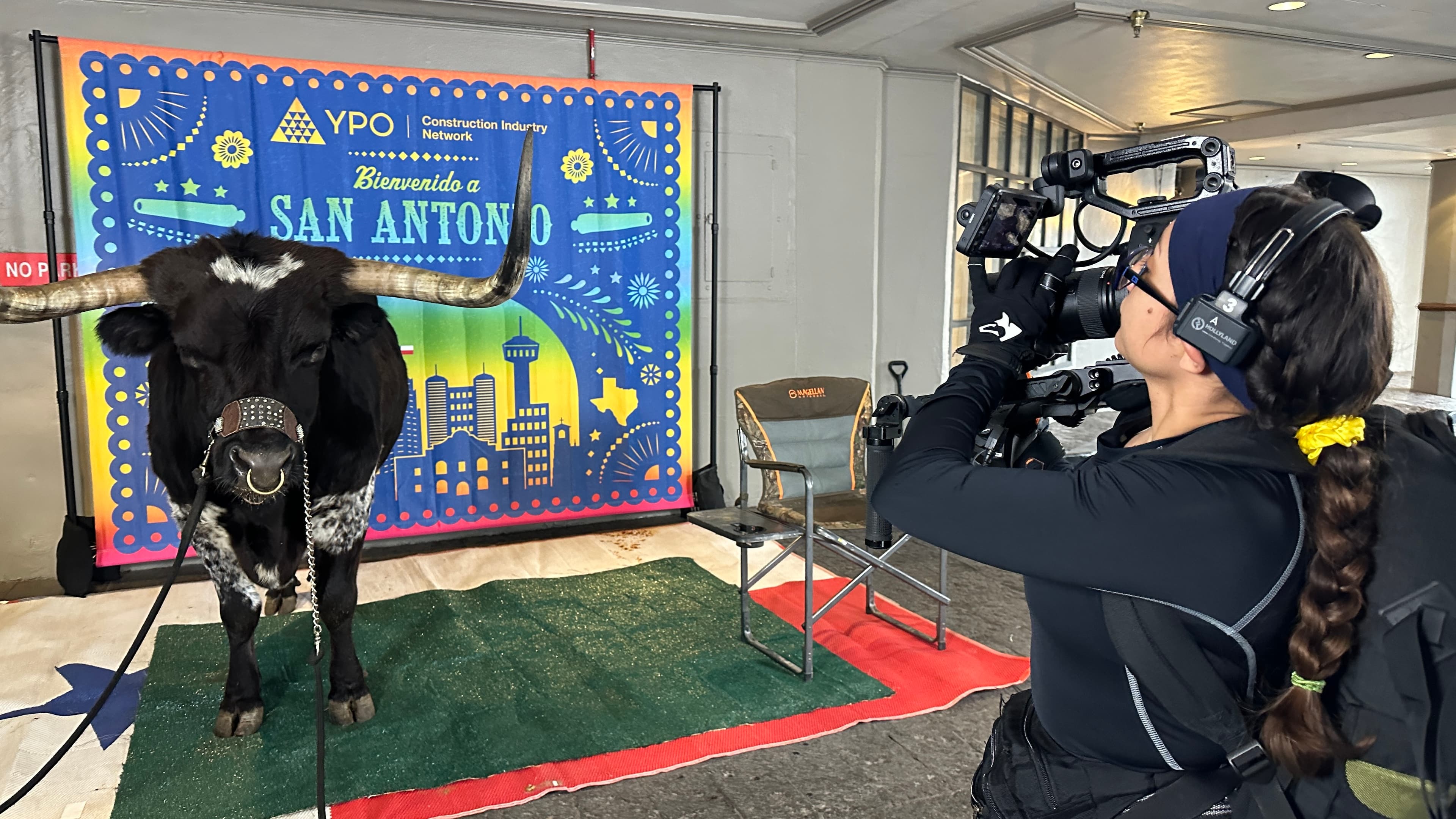Media Bar camera operator filming a San Antonio event
