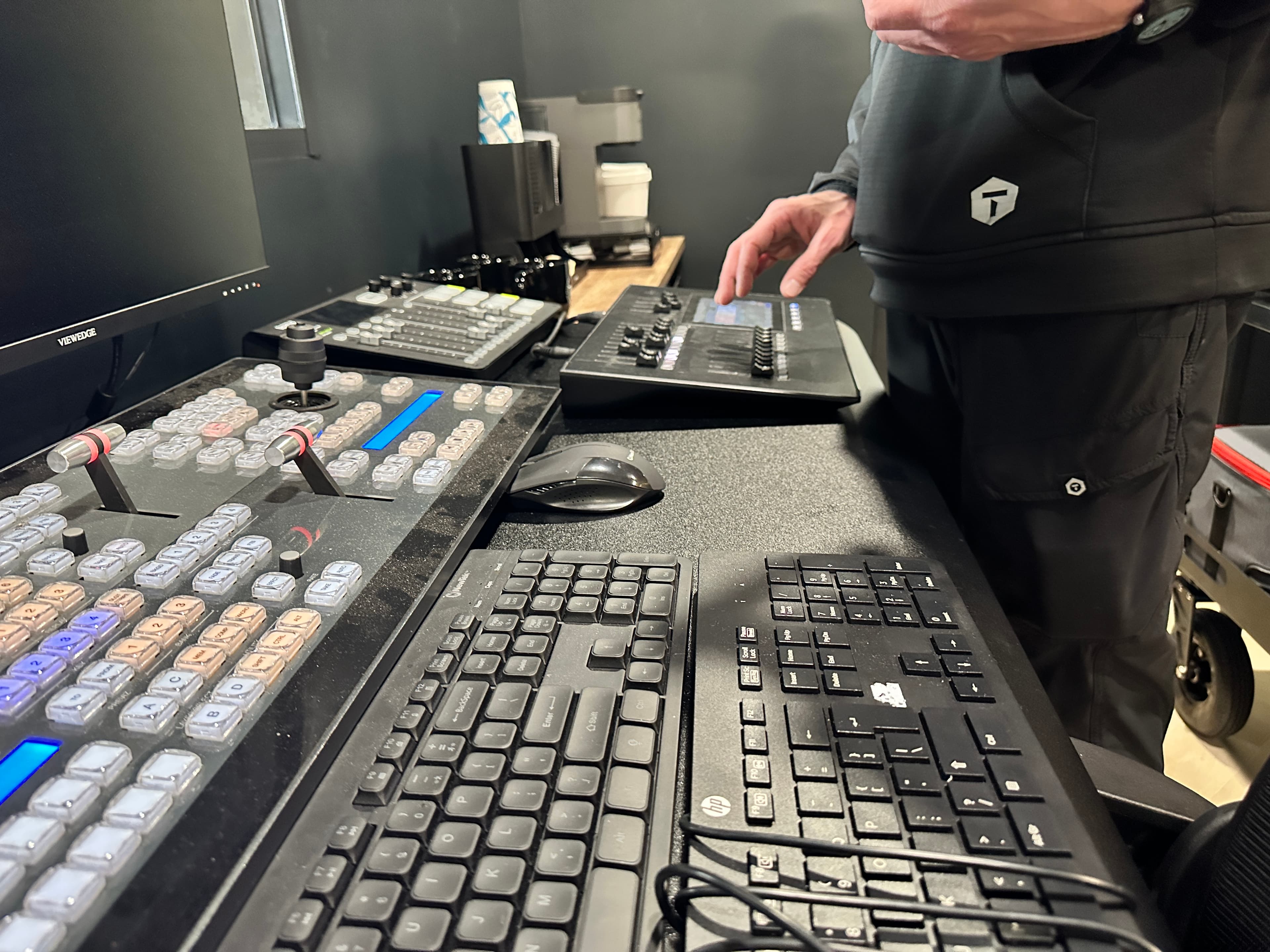Production switching and lighting controls inside the control room