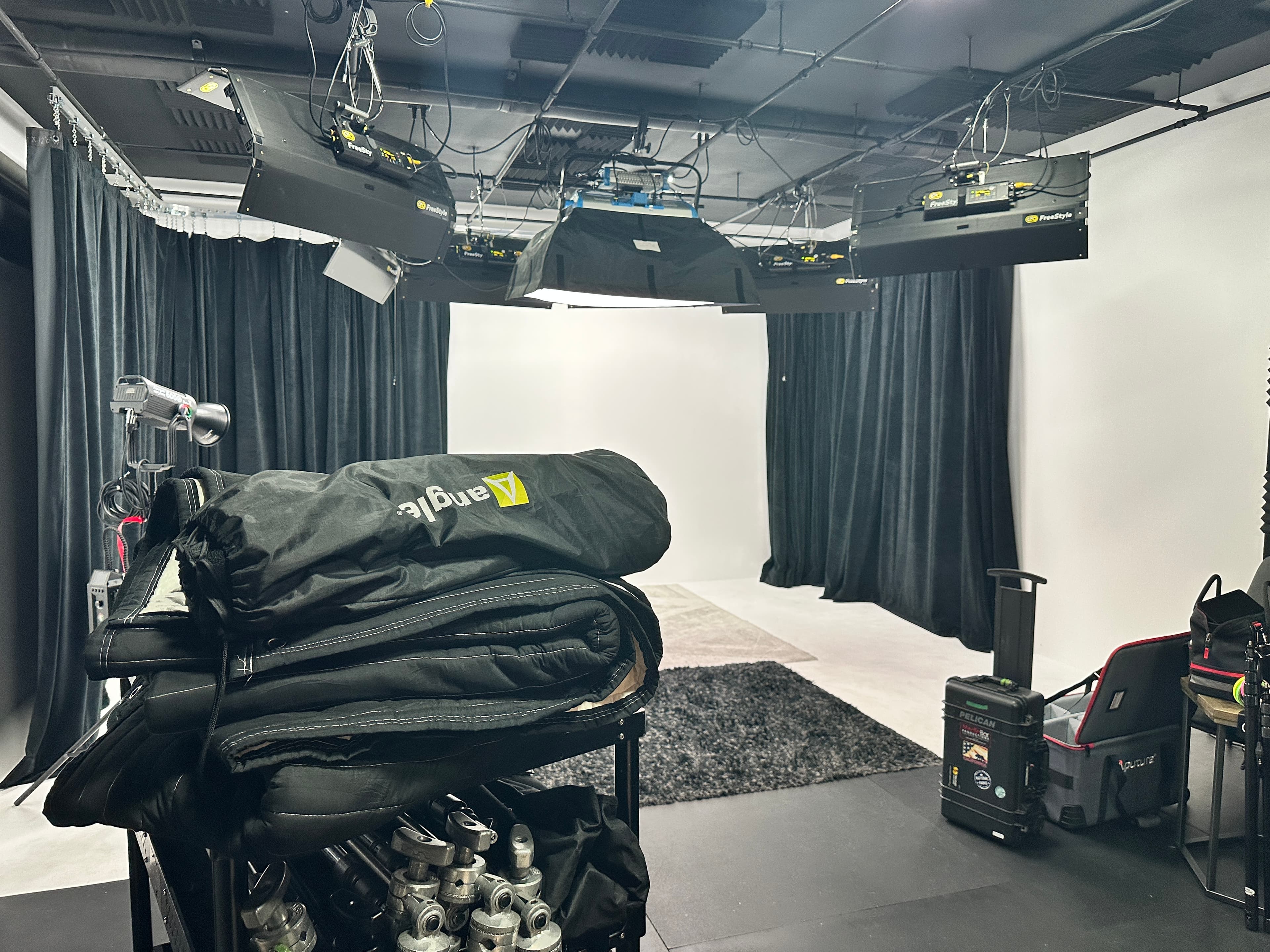 Wide view of the Media Bar Productions studio and lighting grid